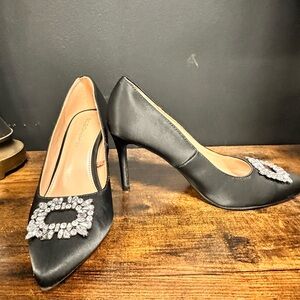 BCBGeneration Black Satin Pointed Toe Heels with Crystal Brooch